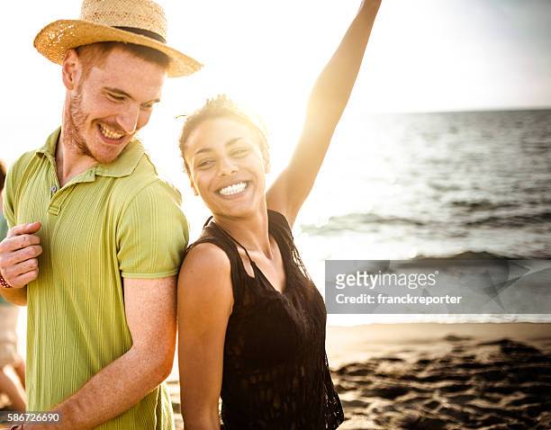 beach party on summer - lens flare young people dancing on beach stock pictures, royalty-free photos & images