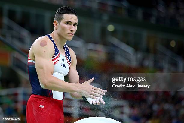 Alexander Naddour of the United States prepares to compete on the pommel horse in the Artistic Gymnastics Men's Team qualification on Day 1 of the...