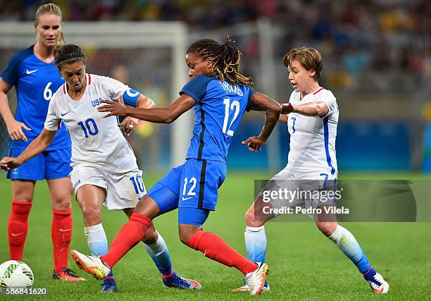 Elodie Thomis of France and Meghan Klingenberg of United States battle for the ball during the Women's Group G first round match between United...