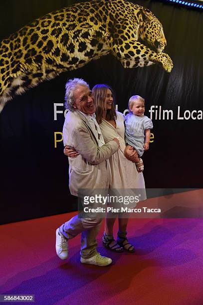 Abel Ferrara, his wife Christina and their daughter attend the Lifetime Achievement Award to Harvey Keitel during the 69th Locarno Film Festival on...
