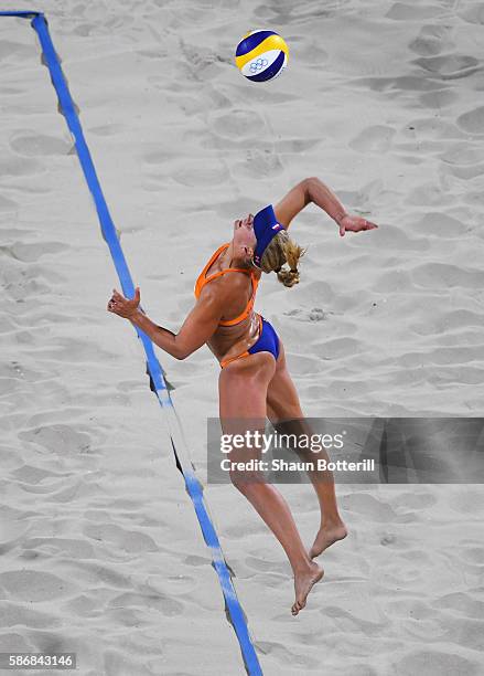 Marleen van Iersel of the Netherlands serves during the Women's Beach Volleyball preliminary round Pool F match against Olaya Perez Pazo and...