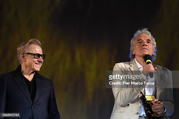 Abel Ferrara gives the Lifetime Achievement Award to Harvey Keitel during the 69th Locarno Film Festival on August 6, 2016 in Locarno, Switzerland.