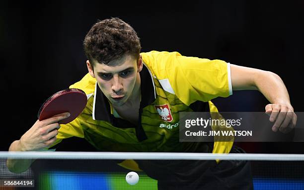 Poland's Jakub Dyjas hits a shot in his men's singles qualification round table tennis match at the Riocentro venue during the Rio 2016 Olympic Games...