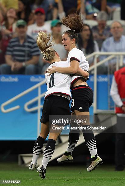 Sara Dabritz of Germany celebrates with Leonie Maier after scoring a goal during the first half against Australia in the Women's First Round Group F...