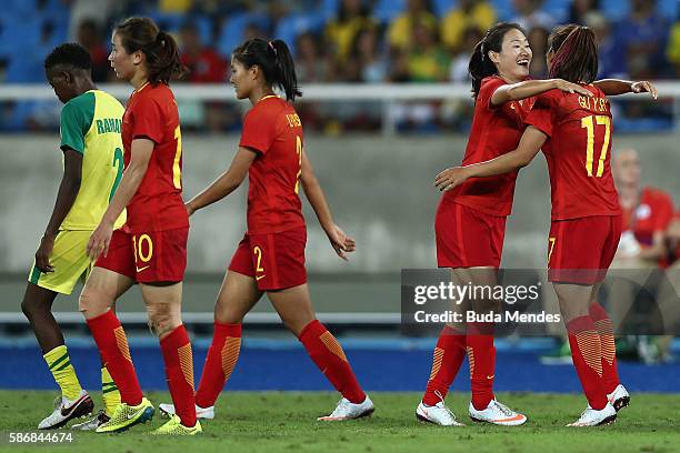 Yasha Gu of China celebrates with teammates after scoring China's first goal during the Women's Group E first round match between South Africa and...