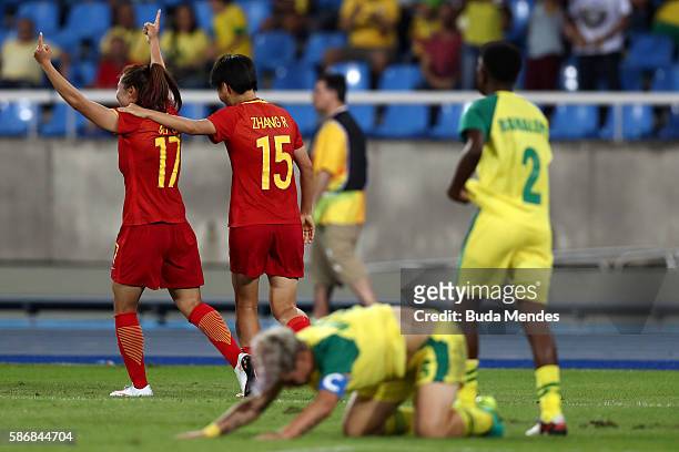 Yasha Gu of China celebrates with teammate Rui Zhang after scoring China's first goal during the Women's Group E first round match between South...