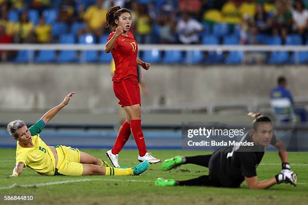 Yasha Gu of China celebrates after scoring China's first goal past Roxanne Barker and Janine van Wyk of South Africa during the Women's Group E first...