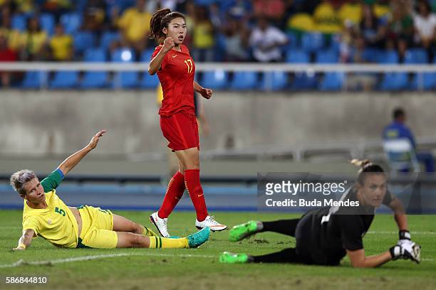 Yasha Gu of China celebrates after scoring China's first goal past Roxanne Barker and Janine van Wyk of South Africa during the Women's Group E first...