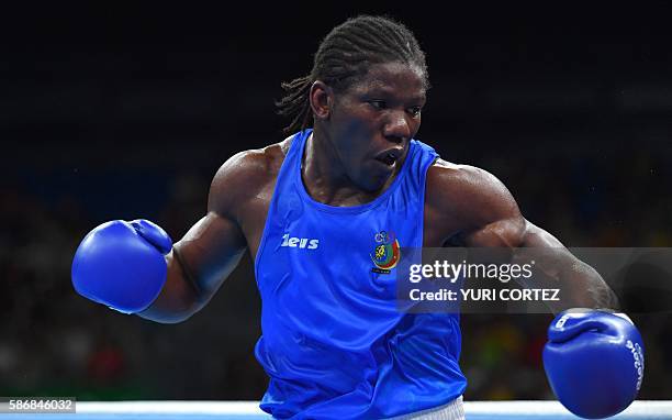 Cameroon's Hassan Ndam Njikam reacts during the Men's Light Heavy boxing match against Brazil's Michel Borges at the Rio 2016 Olympic Games at the...