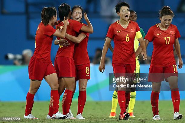 Ruyin Tan of China celebrates with teammates after scoring China's second goal during the Women's Group E first round match between South Africa and...