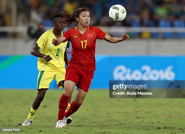 Yasha Gu of China watches the ball against Lebohang Ramalepe of South Africa during the Women's Group E first round match between South Africa and...