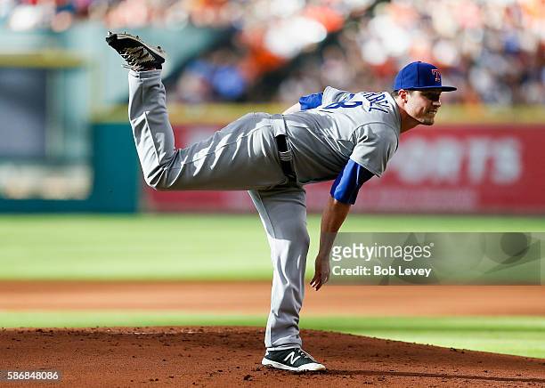 Lucas Harrell of the Texas Rangers pitches in the first inning against the Houston Astros at Minute Maid Park on August 6, 2016 in Houston, Texas.