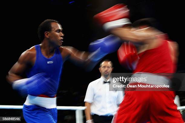 Juan Carlos Carrillo of Colombia exchanges blows with Erkin Adylbek Uulu of Kyrgyzstan during their Men's Heavy 81kg Preliminary bout on Day 1 of the...