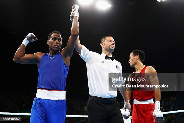 Juan Carlos Carrillo of Colombia celebrates victory over Erkin Adylbek Uulu of Kyrgyzstan after their Men's Heavy 81kg Preliminary bout on Day 1 of...