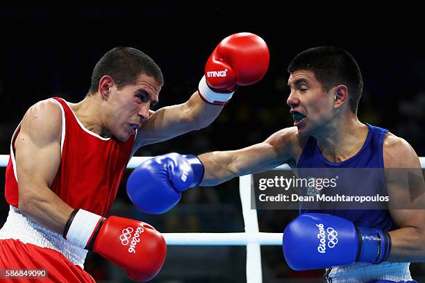 Leandro Blanc of Argentina and Joselito Velazquez of Mexico compete during their Men's Light Fly 46-49kg Preliminary bout on Day 1 of the Rio 2016...