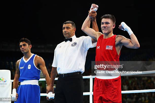 Nico Miguel Hernandez of United States of America Team USA celebrates victory over Manuel Cappai of Italy during their Men's Light Fly 46-49kg...