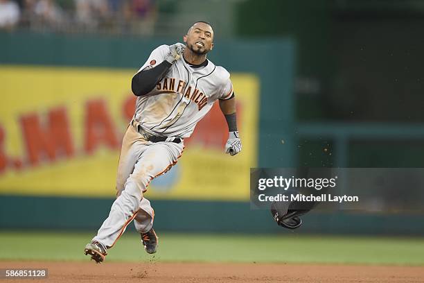 Eduardo Nunez of the San Francisco Giants runs to third for a triple in the forth inning during a baseball game against the Washington Nationals at...