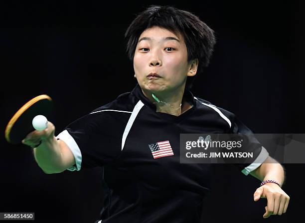 S Yue Wu hits a shot in her women's singles qualification round table tennis match at the Riocentro venue during the Rio 2016 Olympic Games in Rio de...