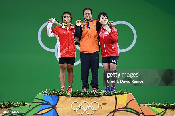 Sri Wahyuni Agustiani of Indonesia , Sopita Tanasan of Thailand , and Hiromi Miyake of Japan pose on the podium after competing in the Women's 48kg...