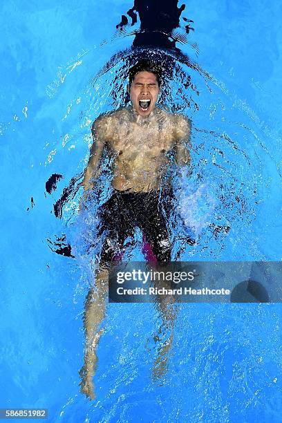 Kosuke Hagino of Japan celebrates winning gold in the Final of the Men's 400m Individual Medley on Day 1 of the Rio 2016 Olympic Games at the Olympic...