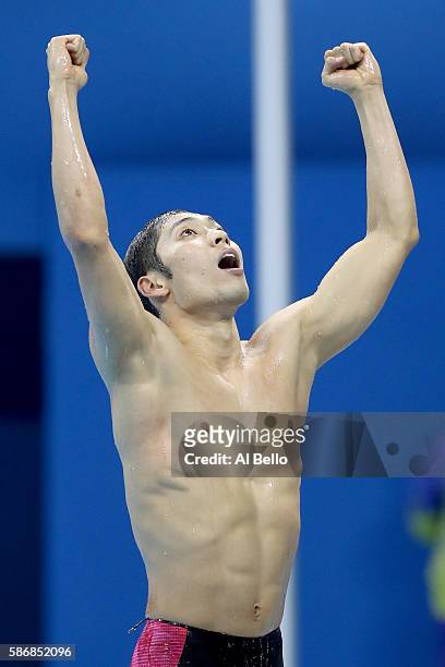 Kosuke Hagino of Japan celebrates winning gold in the Final of the Men's 400m Individual Medley on Day 1 of the Rio 2016 Olympic Games at the Olympic...