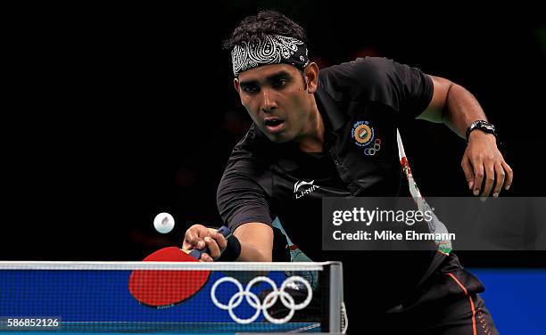 Sharath Kamal Achanta of India plays a Men's Singles first round match against Adrian Crisan of Romania on Day 1 of the Rio 2016 Olympic Games at...