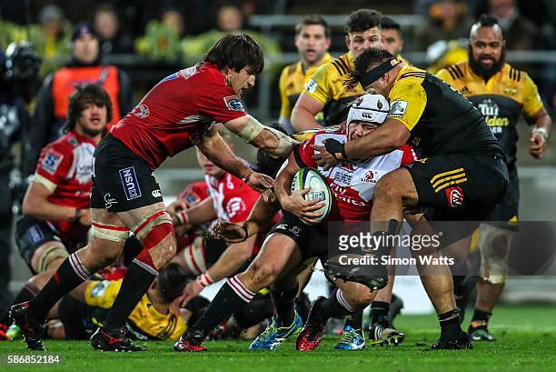 Corne Fourie of the Lions is tackled during the 2016 Super Rugby Final match between the Hurricanes and the Lions at Westpac Stadium on August 6,...
