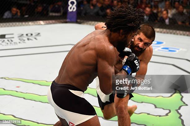 Court McGee punches Dominique Steele in their welterweight bout during the UFC Fight Night event at Vivint Smart Home Arena on August 6, 2016 in Salt...