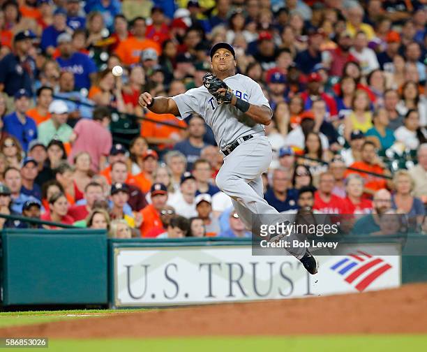 Adrian Beltre of the Texas Rangers throws to first base in the fifth inning but able to retire Carlos Correa of the Houston Astros at Minute Maid...