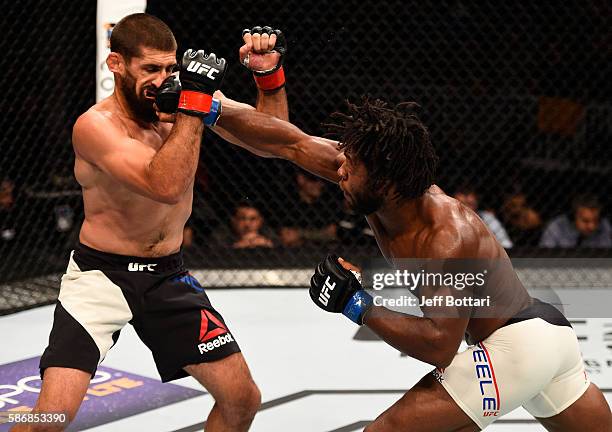 Dominique Steele punches Court McGee in their welterweight bout during the UFC Fight Night event at Vivint Smart Home Arena on August 6, 2016 in Salt...