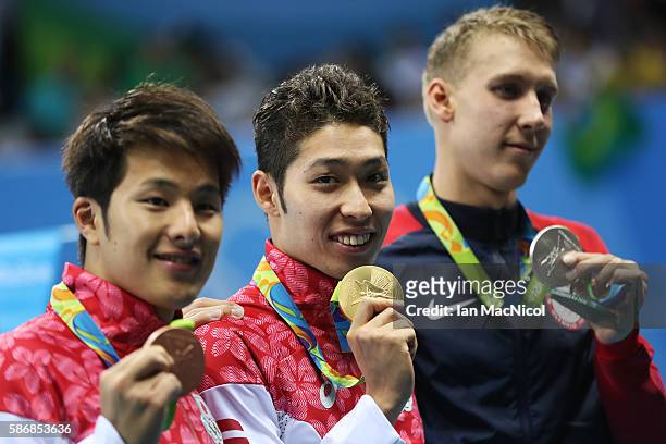Kosuke Hagino of Japan poses with his medal after winning the final of the Men's 400m IM on Day 1 of the Rio 2016 Olympic Games at the Olympic...