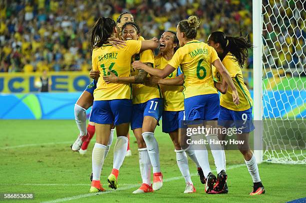 Cristiane of Brazil celebrates her goal with her teammates during the Women's Group E first round match between Brazil and Sweden on Day 1 of the Rio...