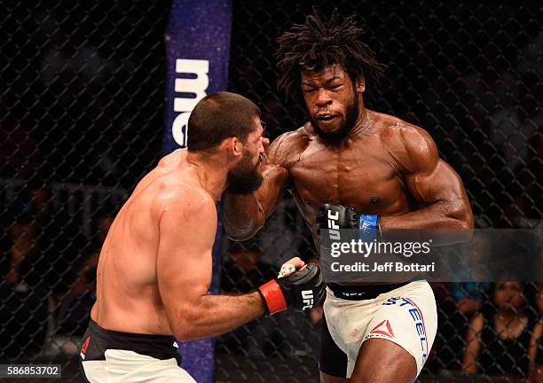 Dominique Steele punches Court McGee in their welterweight bout during the UFC Fight Night event at Vivint Smart Home Arena on August 6, 2016 in Salt...