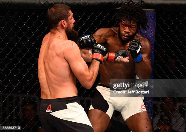 Dominique Steele exchanges punches with Court McGee in their welterweight bout during the UFC Fight Night event at Vivint Smart Home Arena on August...