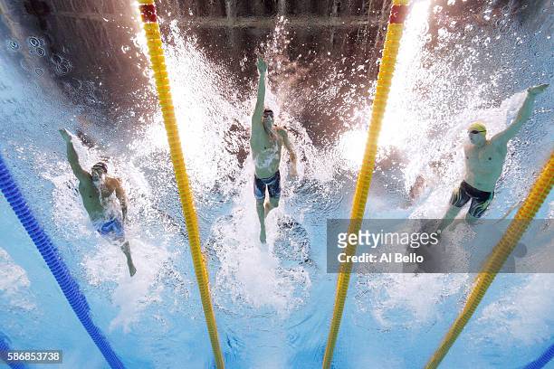 Gabriele Detti of Italy, Conor Dwyer of the United States and Mack Horton of Australia compete in the Final of the Men's 400m Freestyle on Day 1 of...