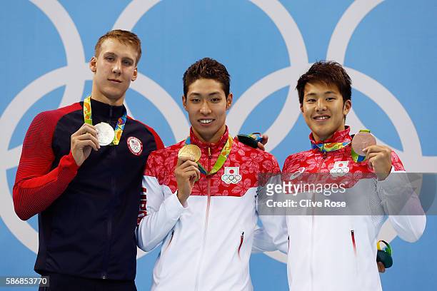 Silver medalist Chase Kalisz of the United States, gold medal medalist Kosuke Hagino of Japan and bronze medalist Daiya Seto of Japan pose during the...