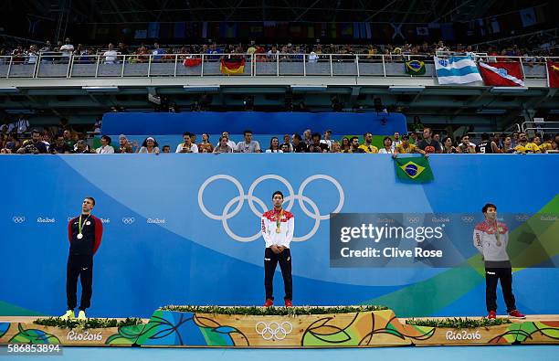 Silver medalist Chase Kalisz of the United States, gold medal medalist Kosuke Hagino of Japan and bronze medalist Daiya Seto of Japan pose during the...