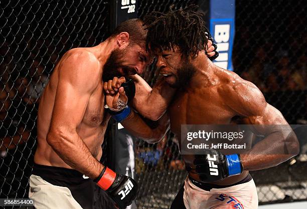 Dominique Steele punches Court McGee in their welterweight bout during the UFC Fight Night event at Vivint Smart Home Arena on August 6, 2016 in Salt...