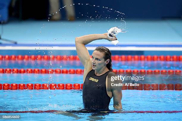Katinka Hosszu of Hungary celebrates winning gold and a new world record in the Final of the Women's 400m Individual Medley on Day 1 of the Rio 2016...