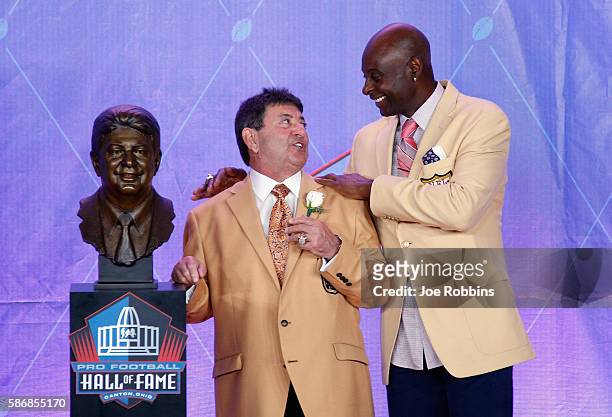 Edward DeBartolo, Jr. , former San Francisco 49ers Owner, is seen with his bronze bust and laughing with former San Francisco 49ers, wide receiver...