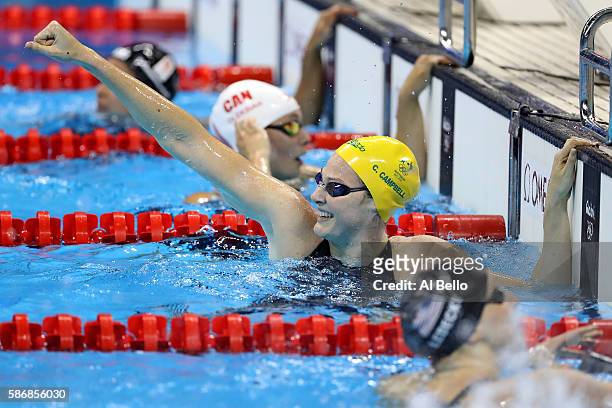 Cate Campbell of Australia celebrates winning gold and a new world record in the Final of the Women's 4 x 100m Freestyle Relay on Day 1 of the Rio...