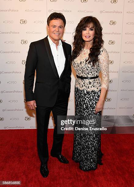 Entertainers Donny Osmond and Marie Osmond arrive at Caesars Palace during the resort's 50th anniversary gala on August 6, 2016 in Las Vegas, Nevada.