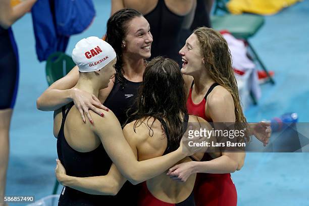 Sandrine Mainville, Chantal Van Landeghem, Taylor Ruck and Penny Oleksak of Canada celebrate winning Bronze medalist XXX poses during the medal...
