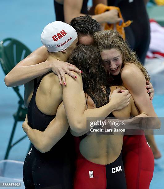 Sandrine Mainville, Chantal Van Landeghem, Taylor Ruck and Penny Oleksak of Canada celebrate winning Bronze medalist XXX poses during the medal...