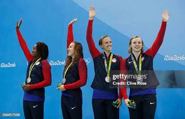 Silver medalist Simone Manuel, Abbey Weitzeil, Dana Vollmer and Kate Ledecky of the United States pose during the medal ceremony for the Final of the...