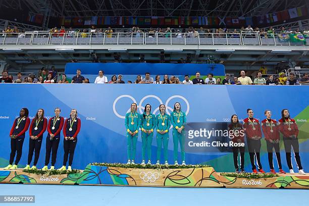 Silver medalist Simone Manuel, Abbey Weitzeil, Dana Vollmer and Kate Ledecky of the United States, gold medalist Emma McKeon, Brittany Elmslie,...