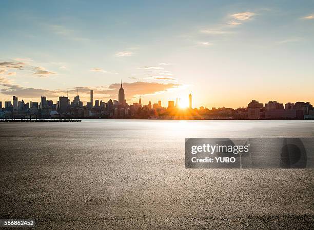 empty parking lot - sunrise city stock-fotos und bilder