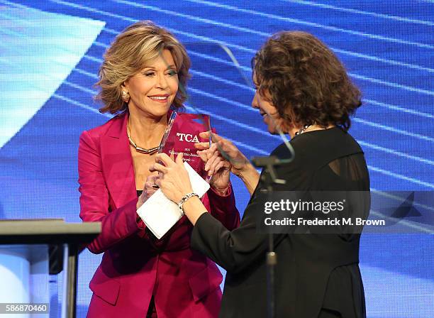 Actress Jane Fonda presents the 'Career Achievement Award' to actress Lily Tomlin onstage at the 32nd annual Television Critics Association Awards...