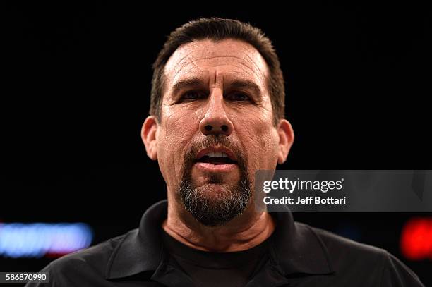Referee John McCarthy announces the judges decision for Rony Jason of Brazil and Dennis Bermudez in their featherweight bout during the UFC Fight...