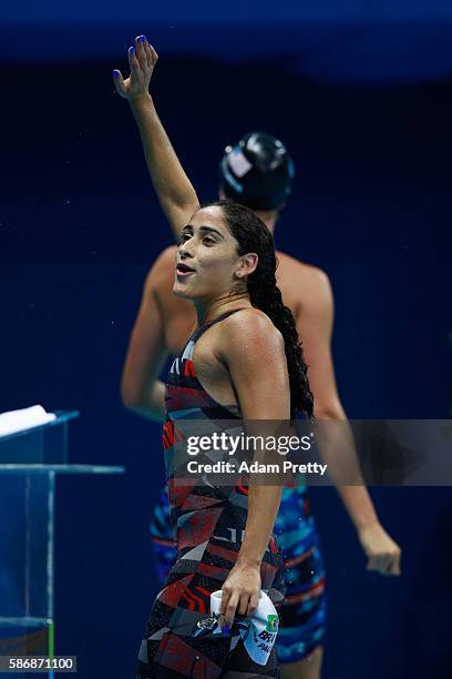 Daynara de Paula of Brazil reacts after the first Semifinal of the Women's 100m Butterfly on Day 1 of the Rio 2016 Olympic Games at the Olympic...